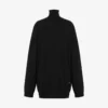 Maglione in lana con M dorata ritagliata