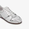 Sneakers con effetto specchio
